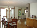 Looking into the dining and living rooms from the kitchen